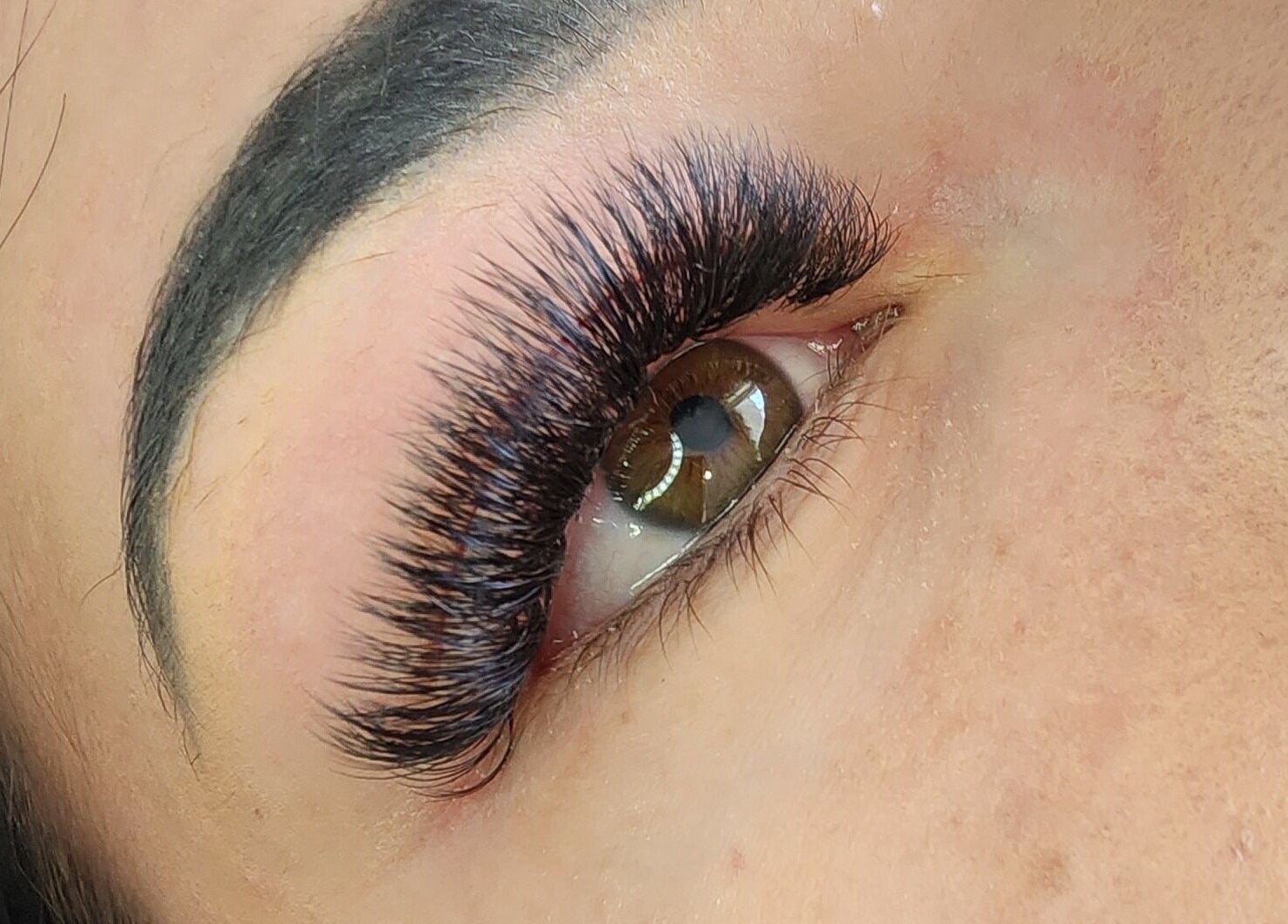 Close-up of voluminous eyelashes at Enchanting Lashes, Rustenburg, North West, ZA showcasing lash expertise.