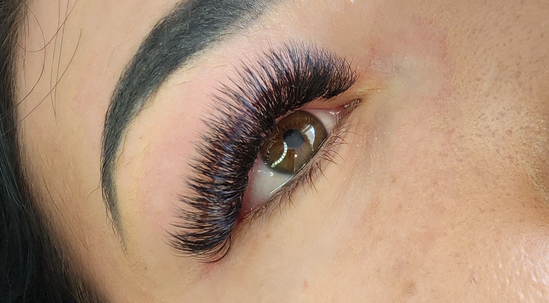 Close-up of voluminous eyelashes at Enchanting Lashes, Rustenburg, North West, ZA showcasing lash expertise.
