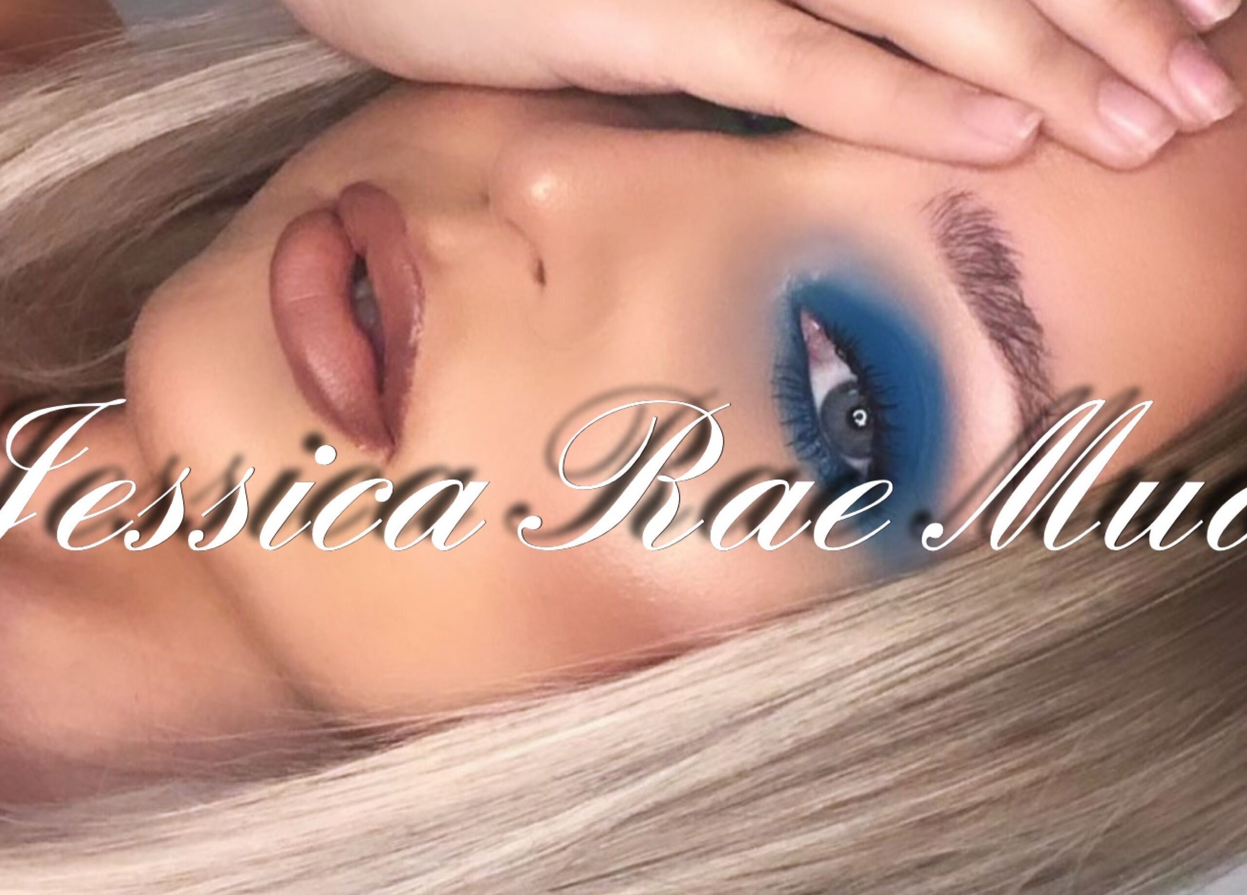 Model with striking blue eye makeup at Jessica Rae MUA, Chester-le-Street, England, GB highlighting artistry.