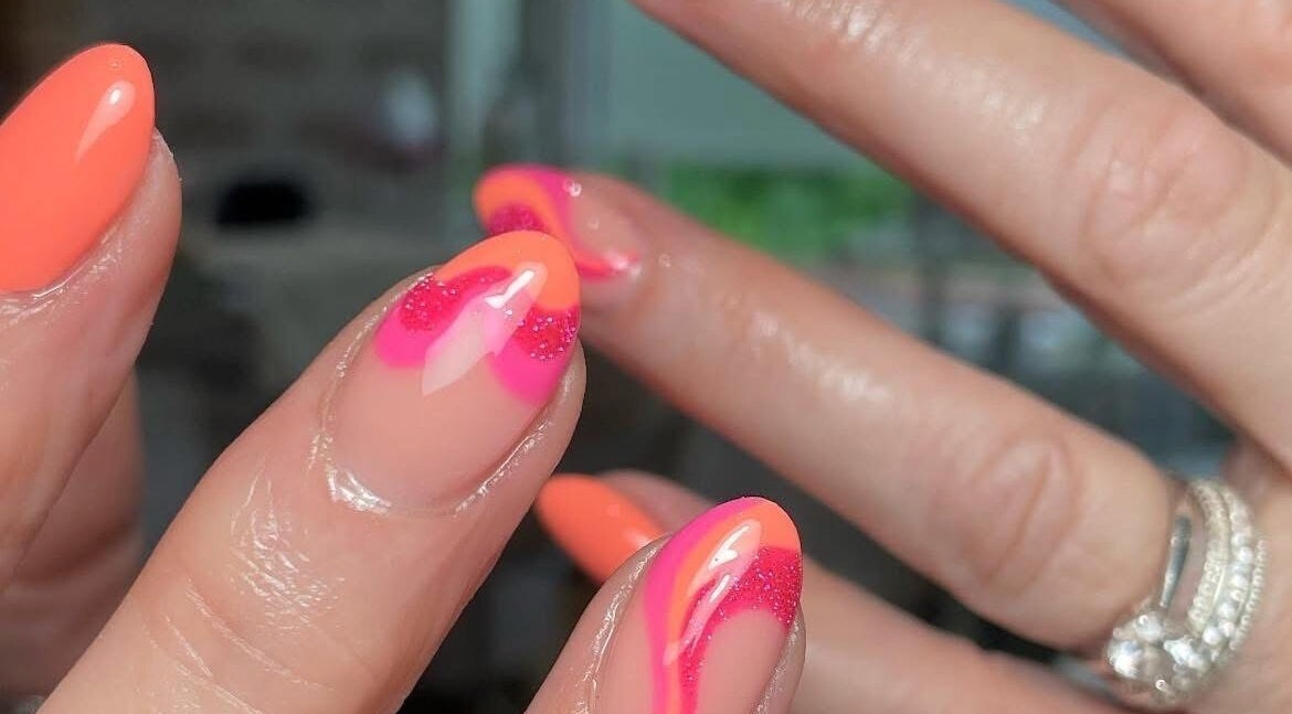 Bright nail art design featuring orange and pink at Jessica Rae MUA, Chester-le-Street, England, GB.