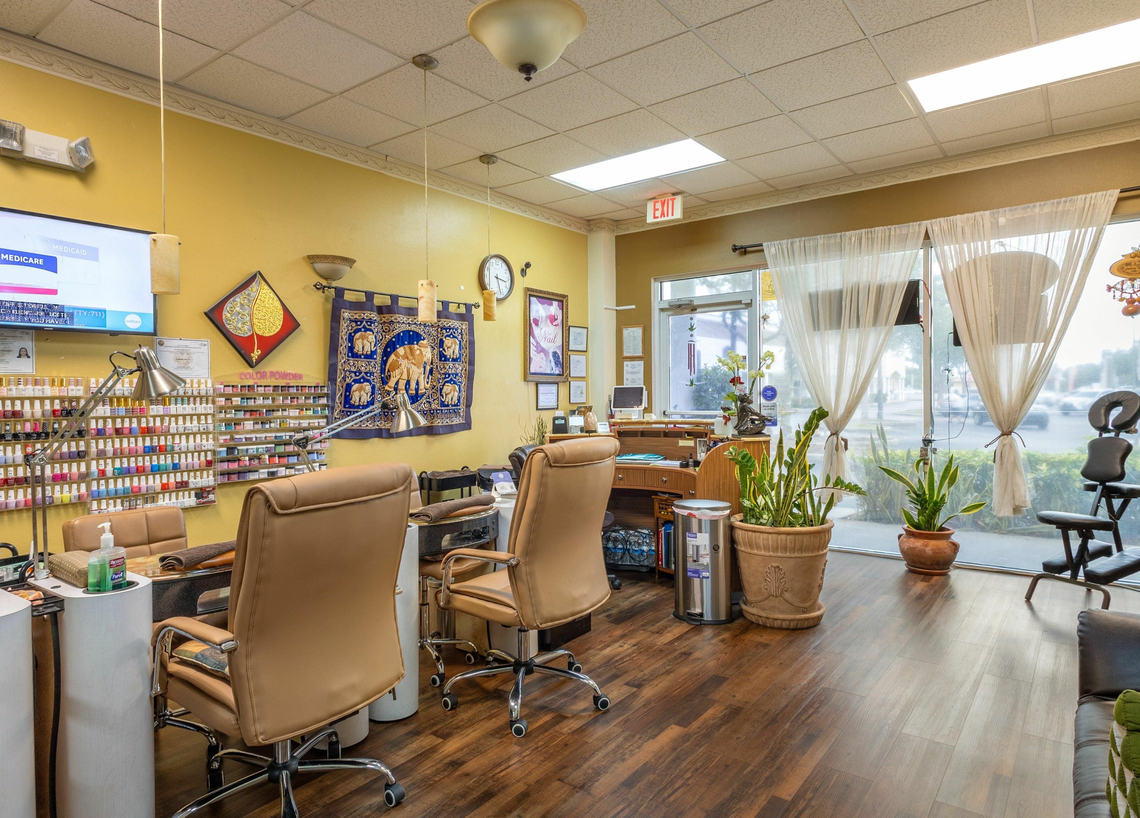 Inside Perfection Nails and Spa, Merritt Island, Florida, US, showcasing cozy seating and nail polish selection.