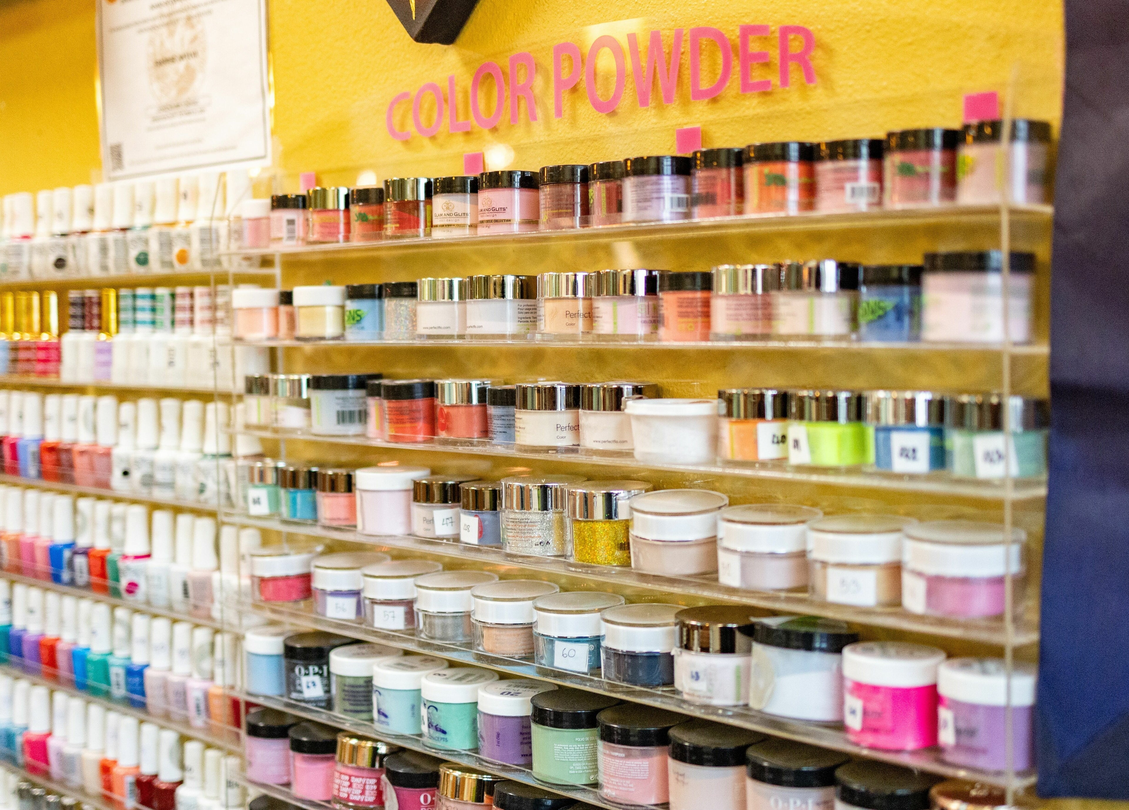 Vibrant nail powders on display at Perfection Nails and Spa in Merritt Island, Florida, US.