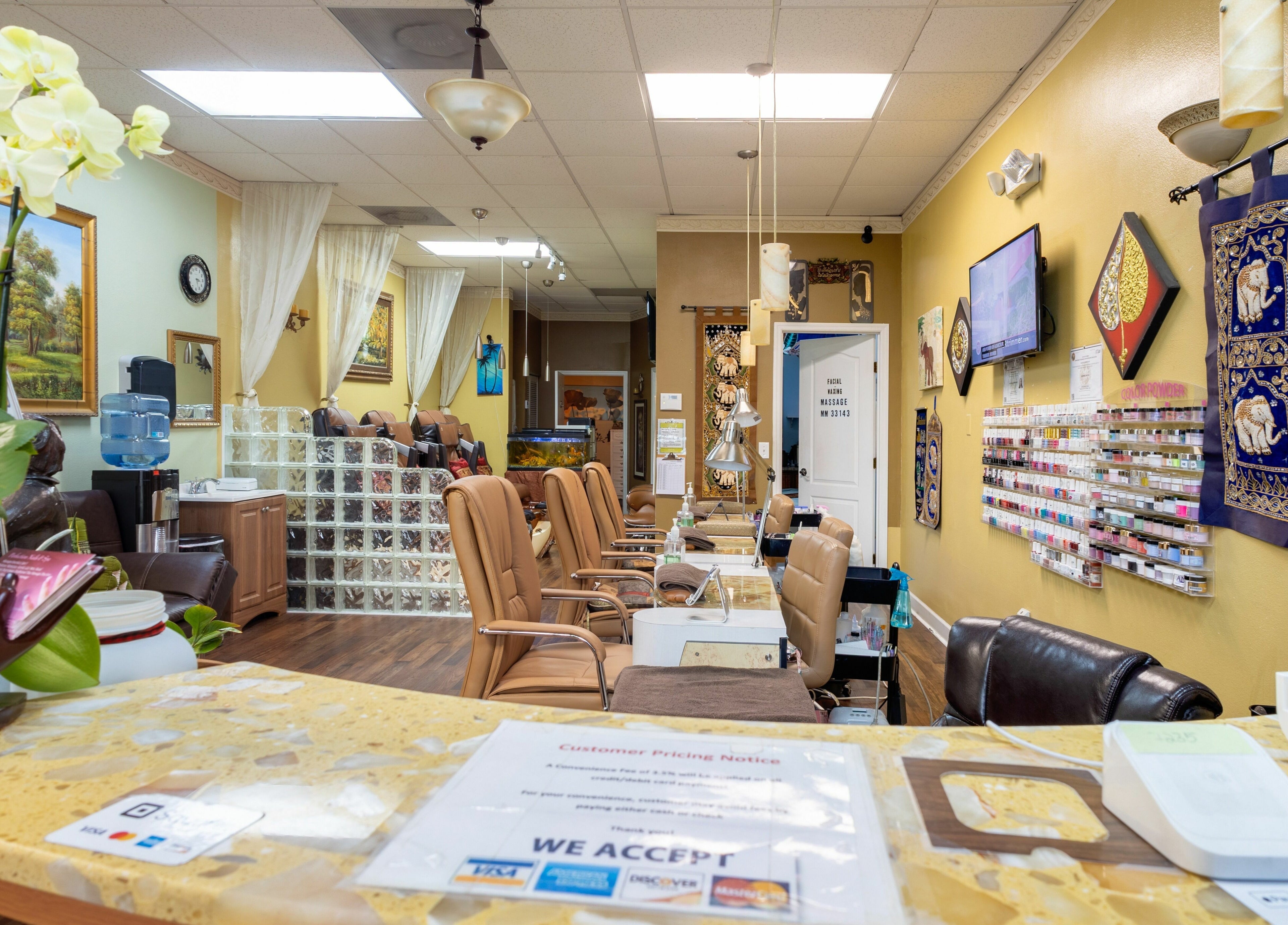 Interior of Perfection Nails and Spa, Merritt Island, Florida, showcasing inviting nail stations and serene decor.