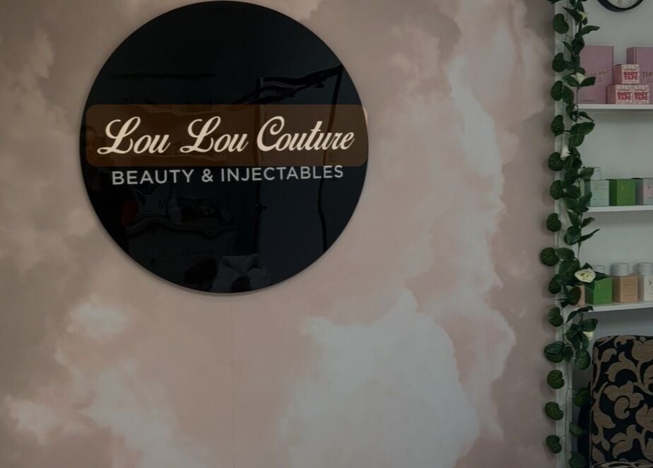 Lou Lou Couture Beauty sign and products at Runaway Bay, Queensland, AU, showcasing a serene and elegant setting.