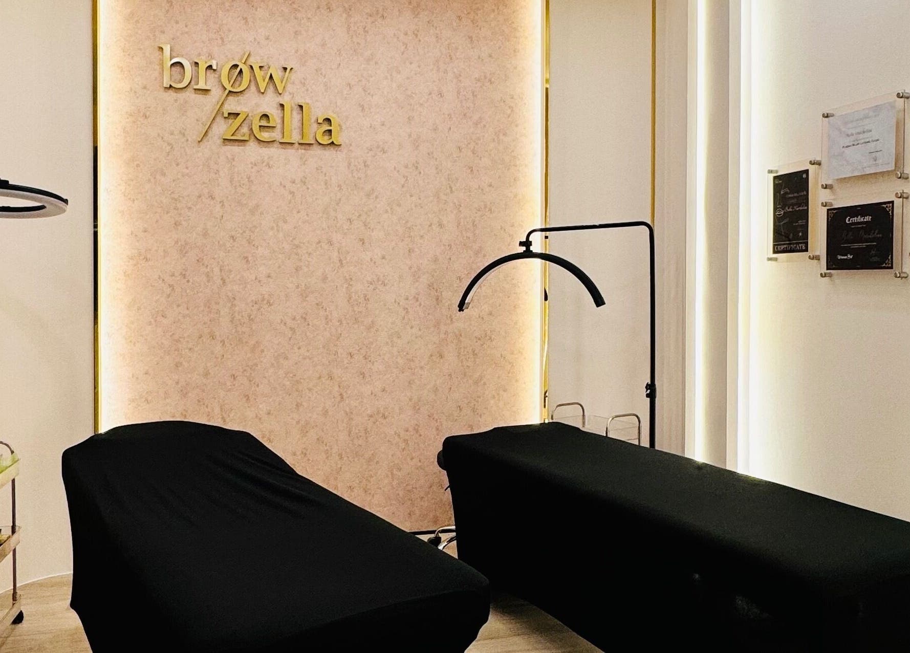 Elegant treatment room at Browzella, East Java, East Java, ID, showcasing two massage tables and soothing decor.