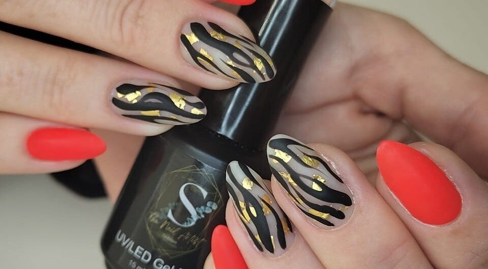 Elegant nail art featuring bold designs at The Nail Artist, Exmouth, England, GB.