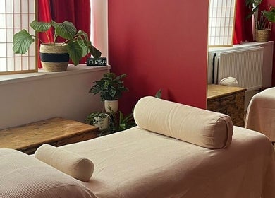 Cozy massage room at The Talking Body Clinic in Glasgow, Scotland, GB featuring tranquil decor and relaxing ambiance.