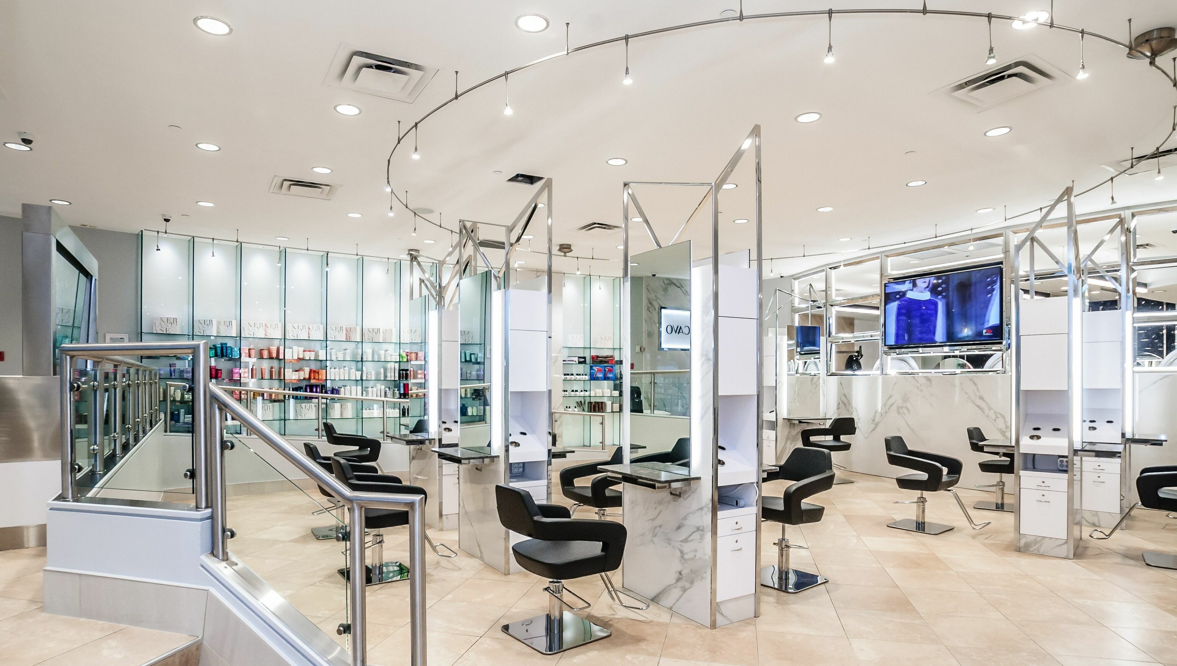 Modern interior of Salon Scavo in Toronto, Ontario, CA with sleek styling chairs and minimalistic decor.