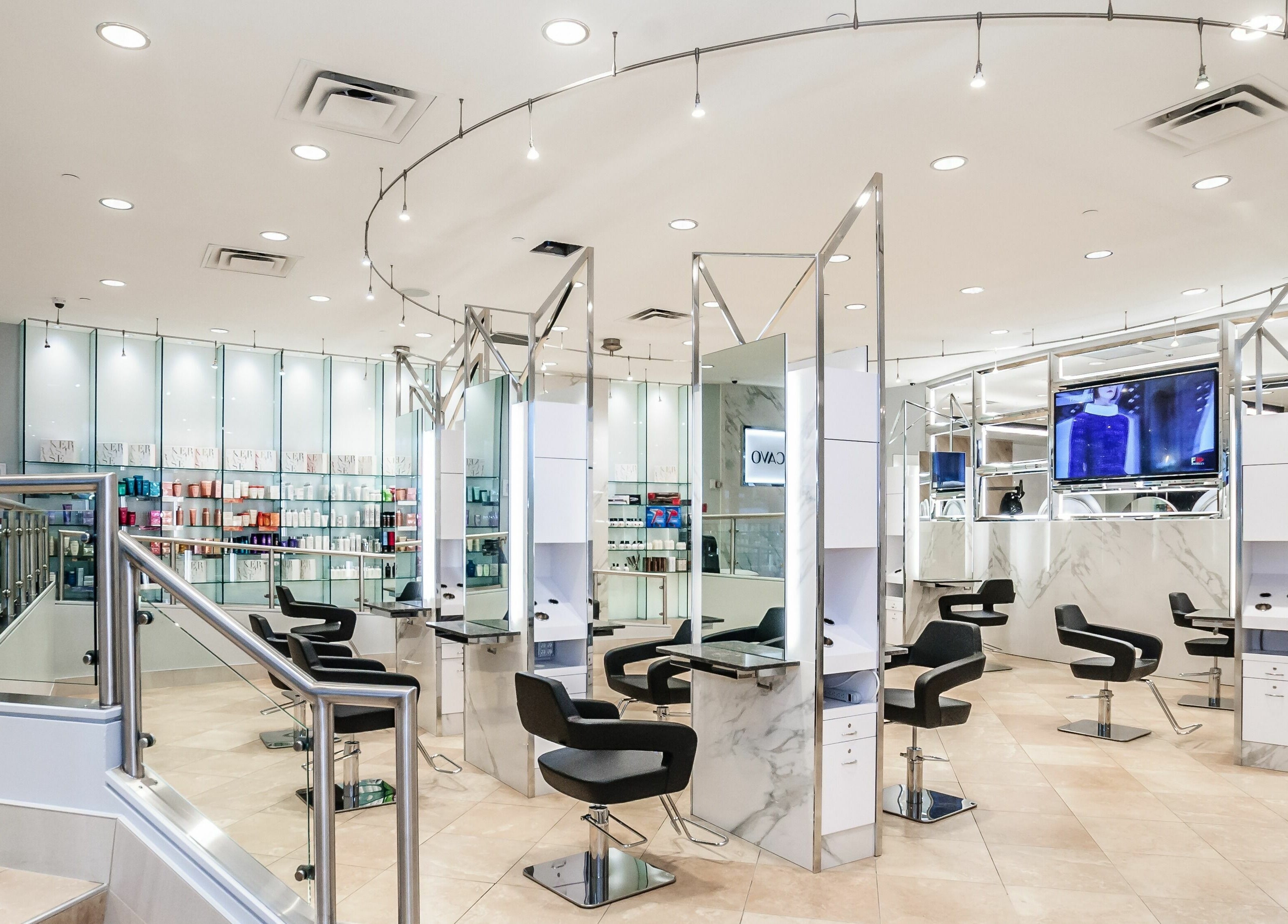 Modern interior of Salon Scavo in Toronto, Ontario, CA with sleek styling chairs and minimalistic decor.