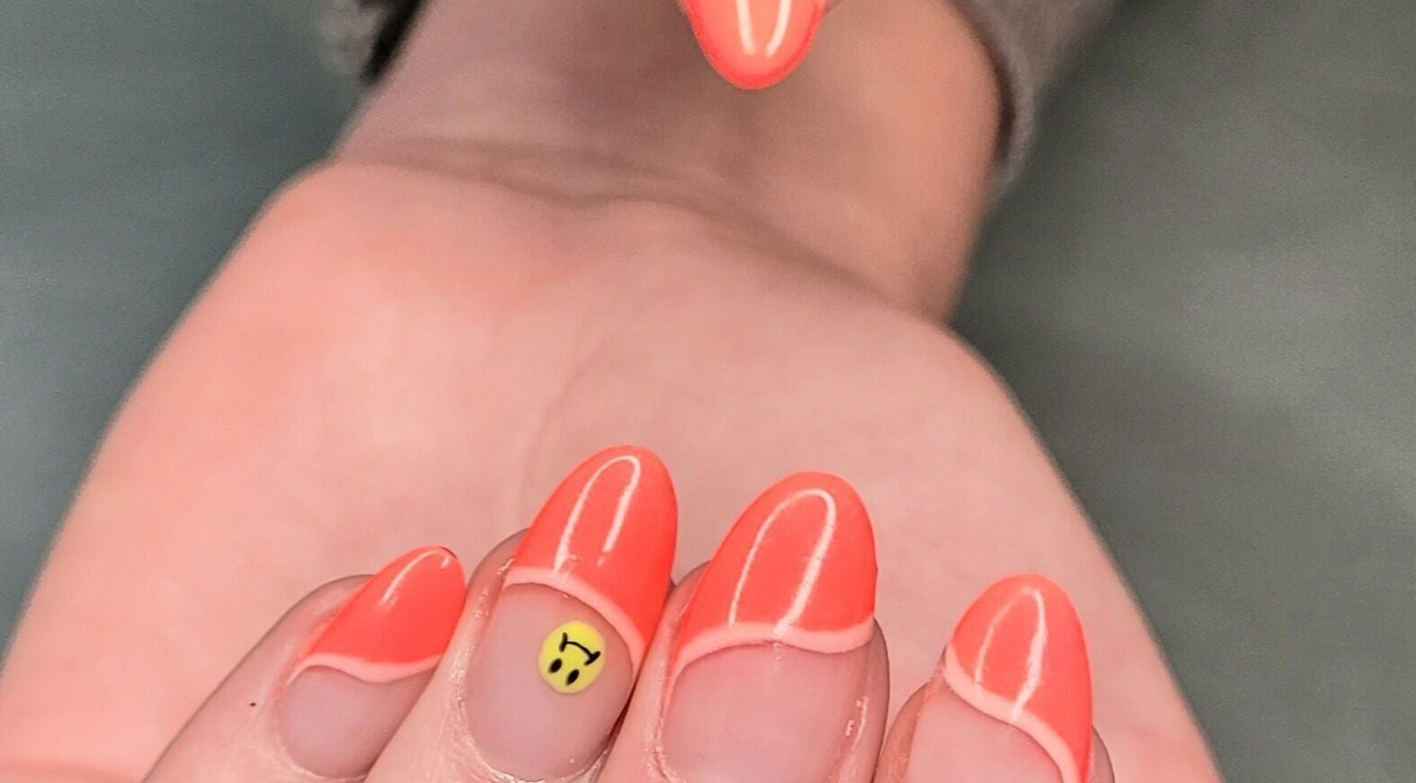 Vibrant neon nails with smiley design at Nails by Snow in Pretoria, Gauteng, ZA. Creative nail art showcased.