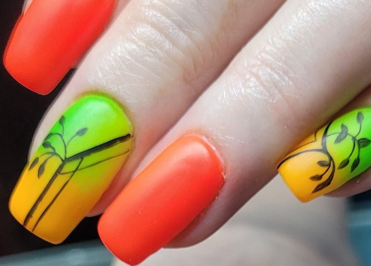Bright red, green, and yellow nail art at Nails by Snow, Pretoria, Gauteng, ZA.