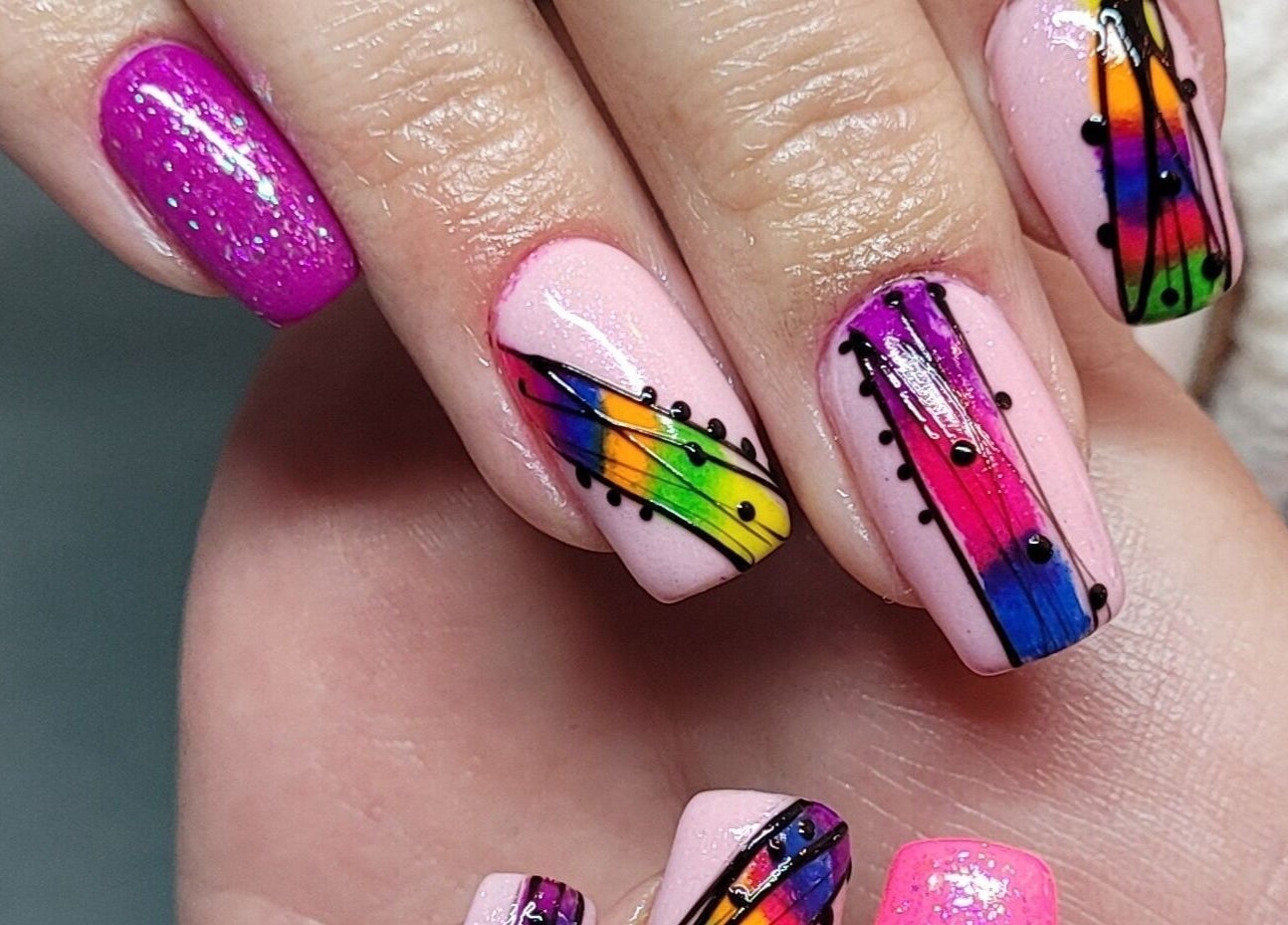 Colorful abstract nail art at Nails by Snow, Pretoria, Gauteng, ZA. Features rainbow and pink designs.
