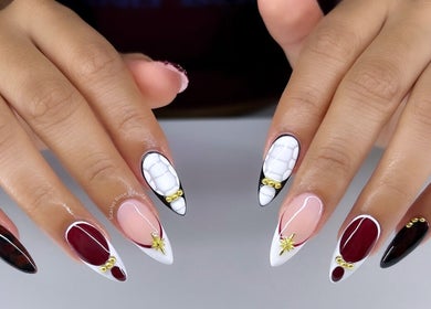 Intricate nail art at Scarlet Rose Beauty in Cape Town, Western Cape, ZA featuring unique designs and gemstone accents.