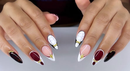 Intricate nail art at Scarlet Rose Beauty in Cape Town, Western Cape, ZA featuring unique designs and gemstone accents.