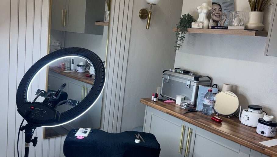Chloe Louise Beauty & Aesthetics at Estetica Skin & Laser, England, features a modern setup with lighting equipment.