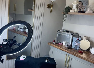 Chloe Louise Beauty & Aesthetics at Estetica Skin & Laser, England, features a modern setup with lighting equipment.