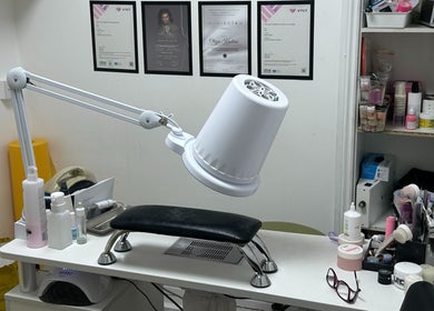 Nail care station at Aleksa Hair and Beauty, Dublin, County Dublin, IE. Neat workspace with tools and certificates.