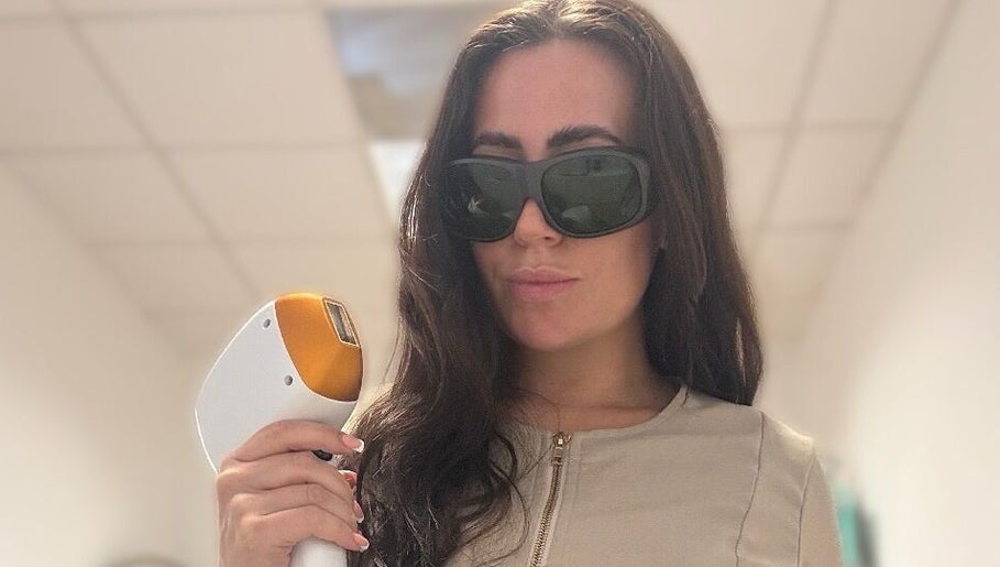 Professional using laser device at Glow Skin Bar in Newcastle, England, GB.