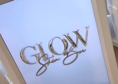 Glow Skin Bar signage displayed on a sleek screen in Newcastle, England, GB venue.
