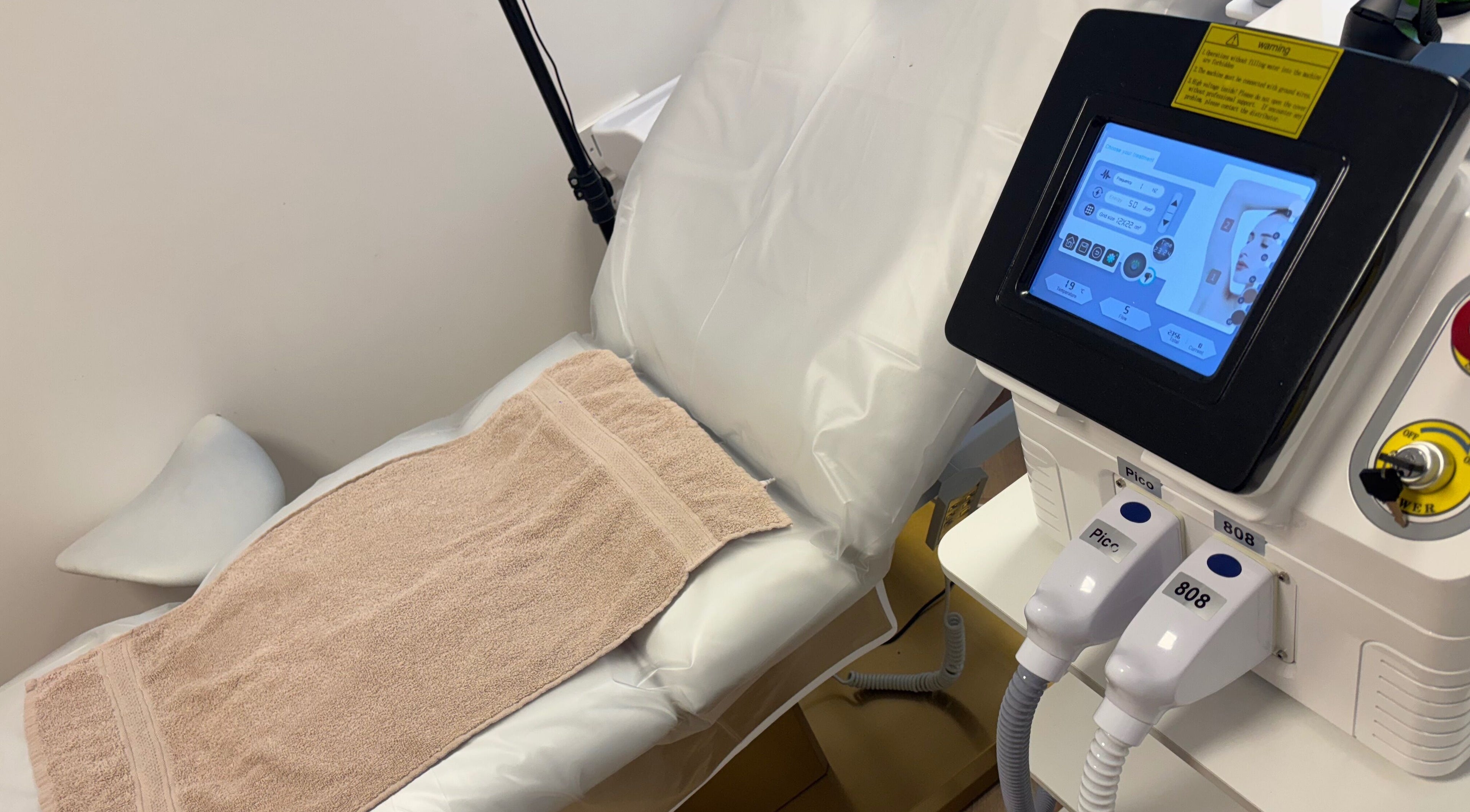 Comfortable treatment bed and modern equipment at Glow Skin Bar, Newcastle, England, GB.