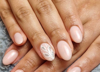 Beautifully manicured nails with delicate design at Ria Dharni, Crawley, England, GB.