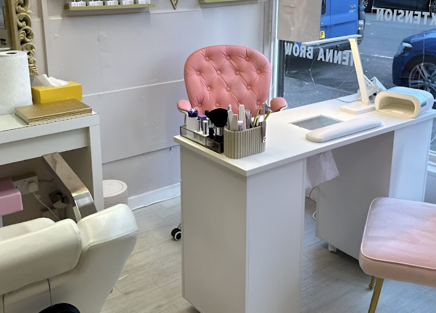 Chic beauty station at Sophie beauty brow & Lash, Glasgow, Scotland, GB, featuring plush pink chairs and elegant decor.