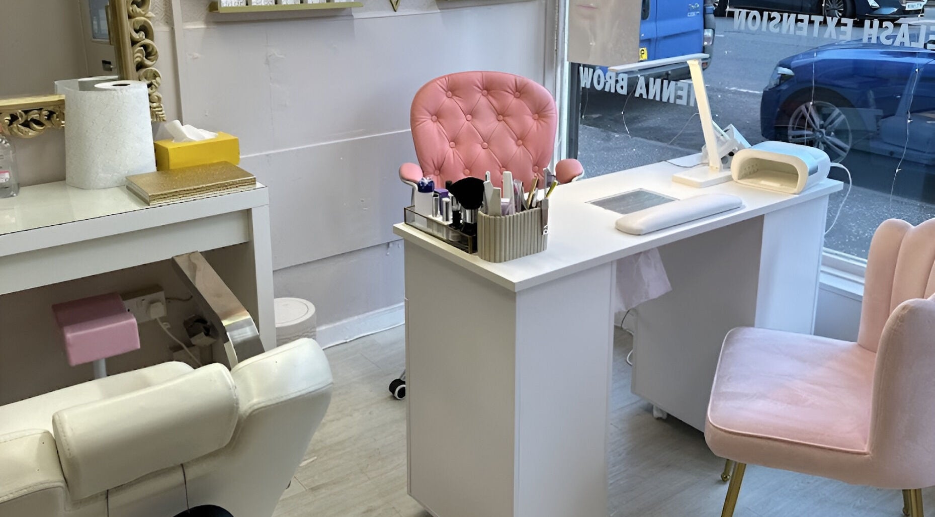 Chic beauty station at Sophie beauty brow & Lash, Glasgow, Scotland, GB, featuring plush pink chairs and elegant decor.