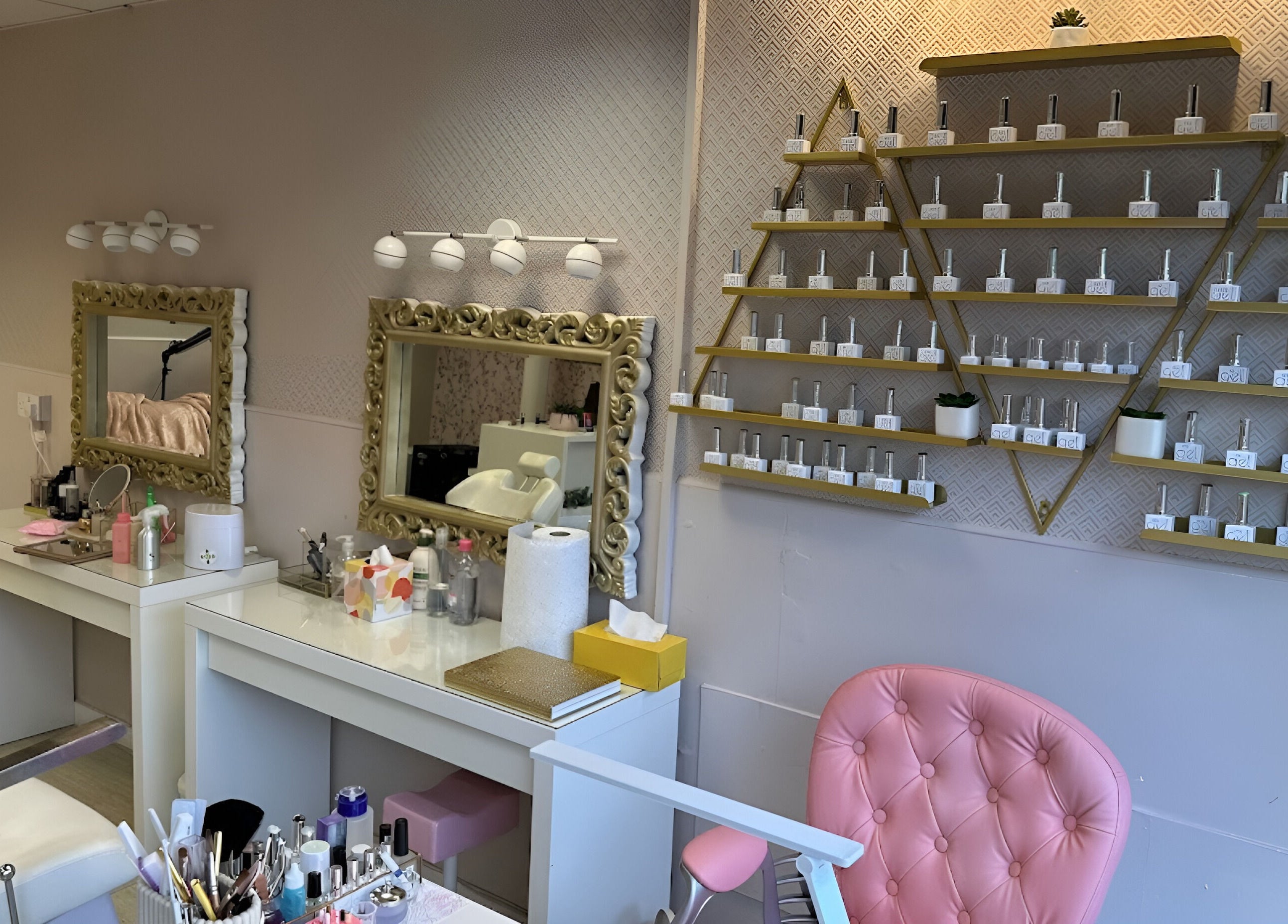 Glamorous interior of Sophie Beauty Brow & Lash in Glasgow, Scotland, GB with ornate mirrors and product displays.