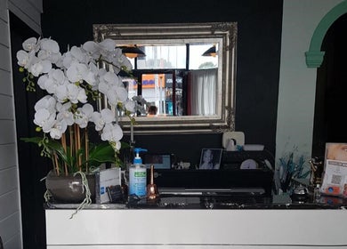 Reception area at Empire Day Spa, Richmond, Victoria, AU with elegant decor and white orchids.