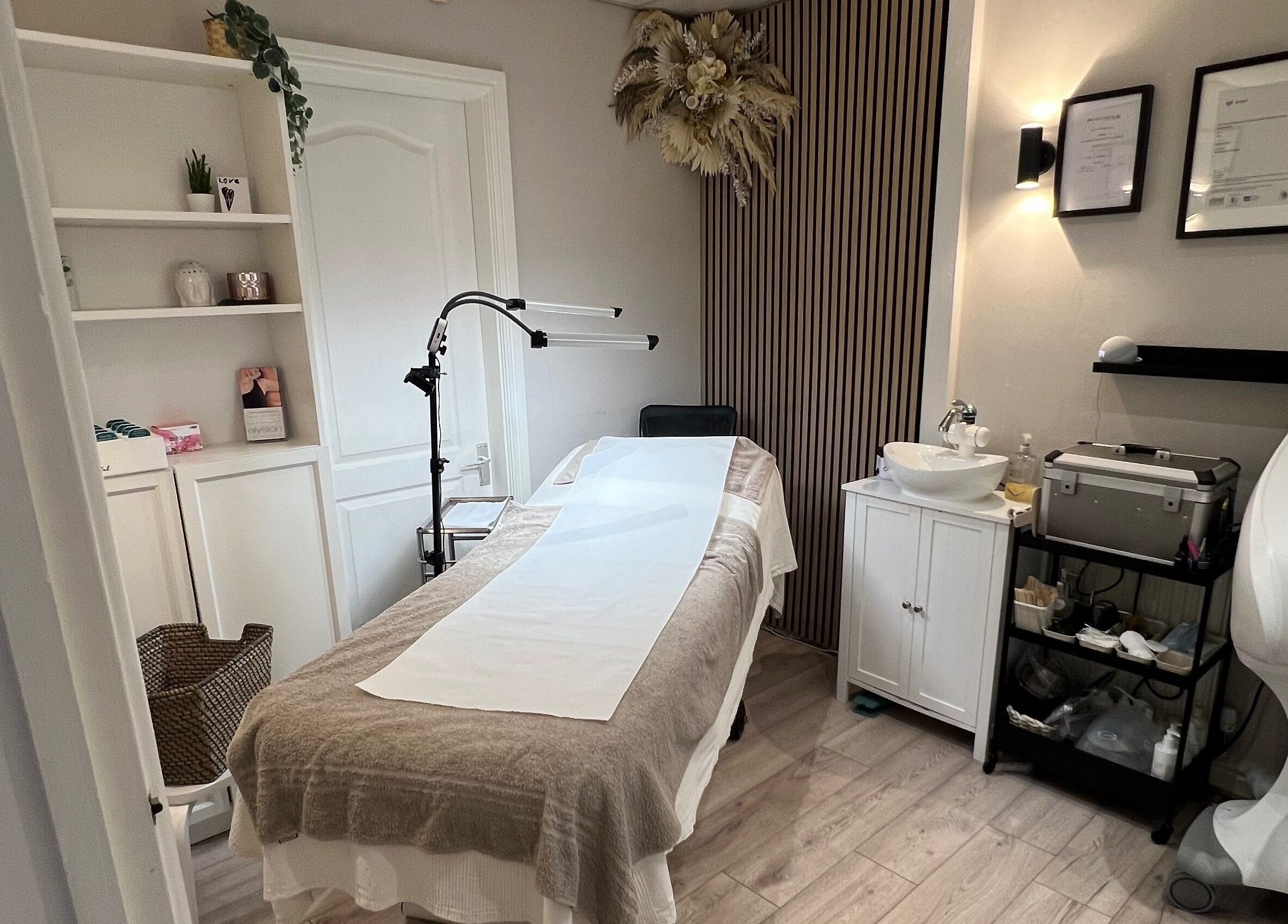 Elegant treatment room at Aesthetically Beautiful in Cheadle, England, GB, offering a calm wellness experience.