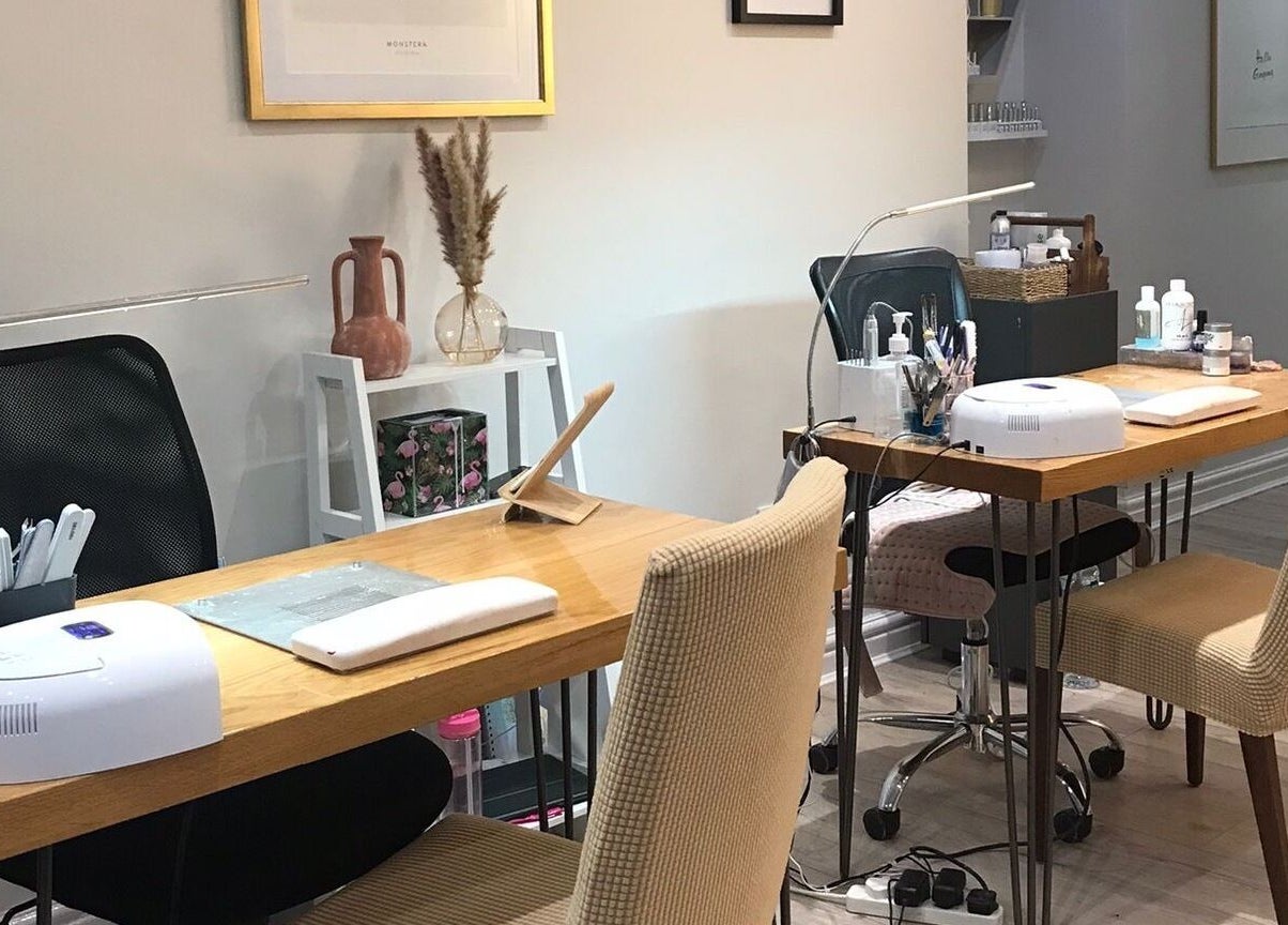 Elegant nail station at Aesthetically Beautiful in Cheadle, England, GB, with manicure tools and cozy seating.
