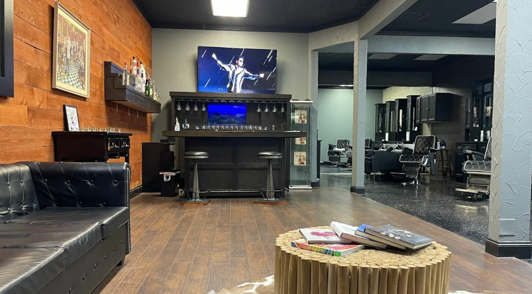 Sophisticated interior of Exclusive Men's Grooming in Dallas, Texas, US showcasing elegant lounge and bar area.