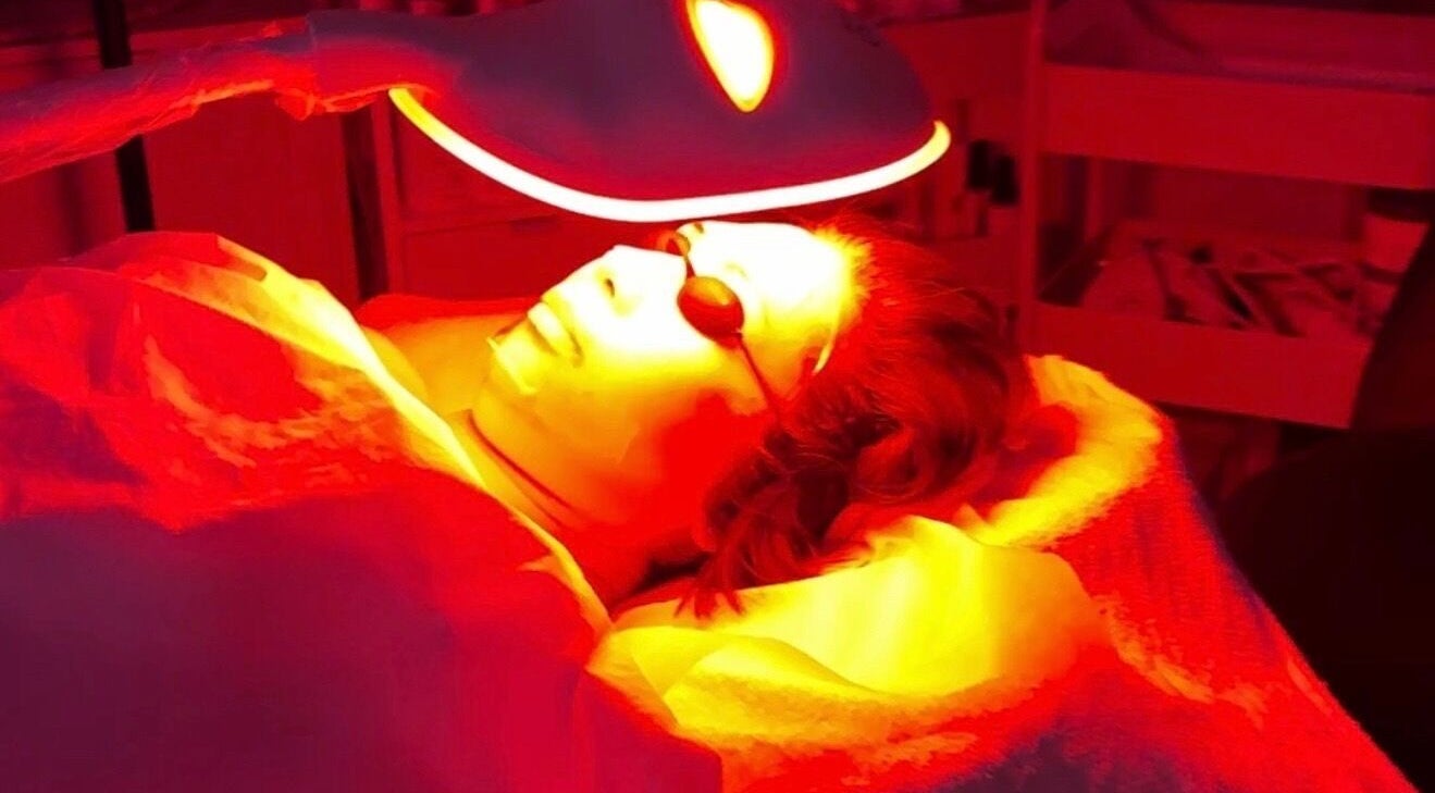 Facial treatment under red light therapy at Balwyn Retreat Sanctuary, Melbourne, Victoria, AU.