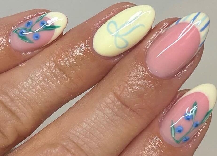Elegant floral nail art at Kasey June Beauty, Chelmsford, England, GB showcasing intricate blue and green designs.