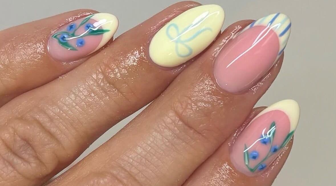Elegant floral nail art at Kasey June Beauty, Chelmsford, England, GB showcasing intricate blue and green designs.