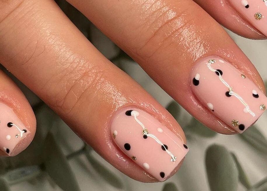 Stylish dotted nail art at Kasey June Beauty, Chelmsford, England, GB. Elegant and modern design.