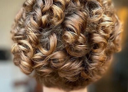 Golden curls styled perfectly at The Curl Studio, Cullompton, England, GB showcasing expert hairstyling techniques.