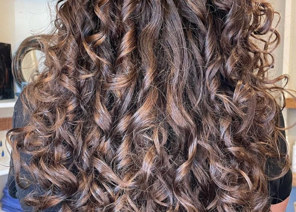 Beautiful curly hairstyle at The Curl Studio in Cullompton, England, GB; showcasing voluminous curls.