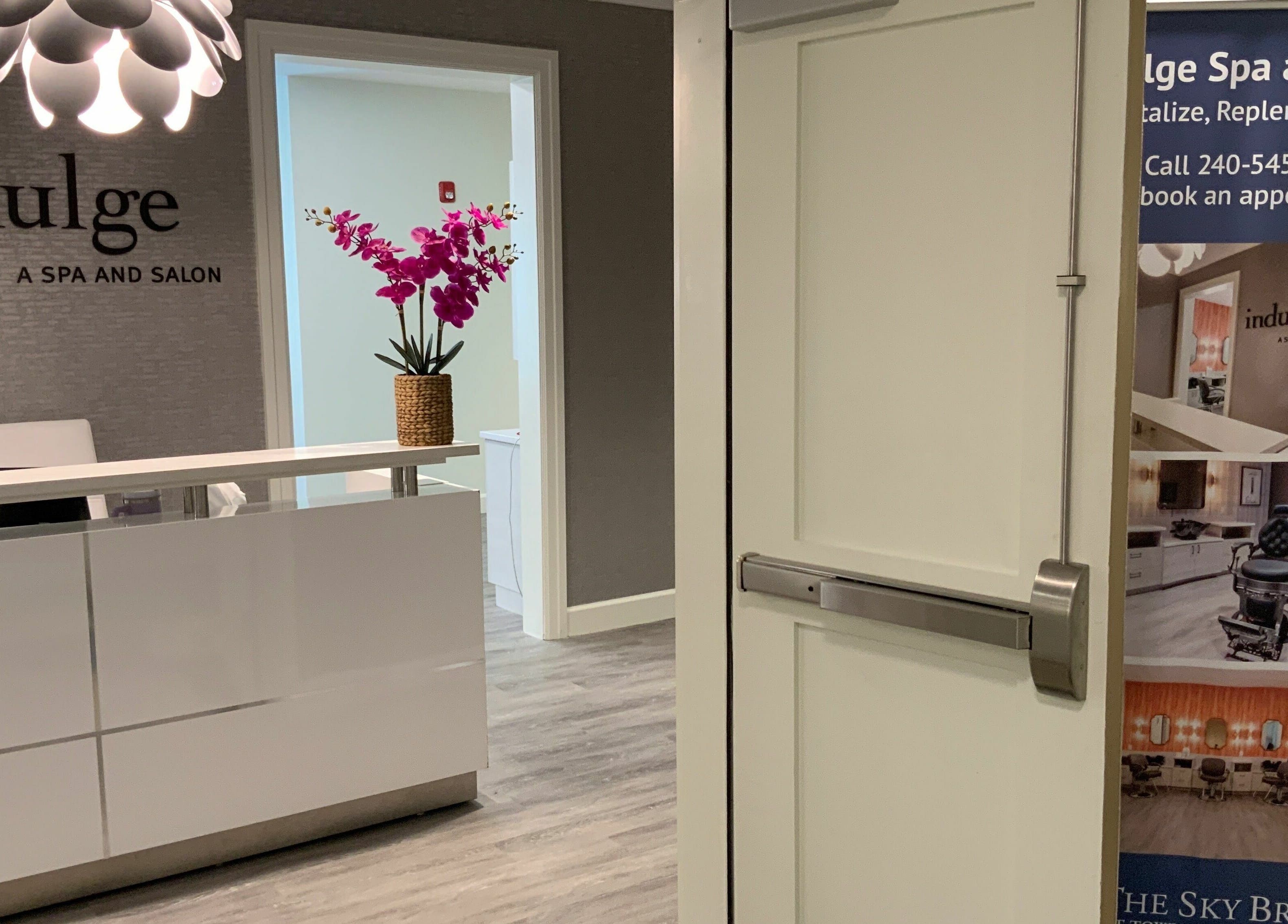 Reception area of Indulge at Sky Bridge at Town Center, Upper Marlboro, Maryland, US with bright decor.