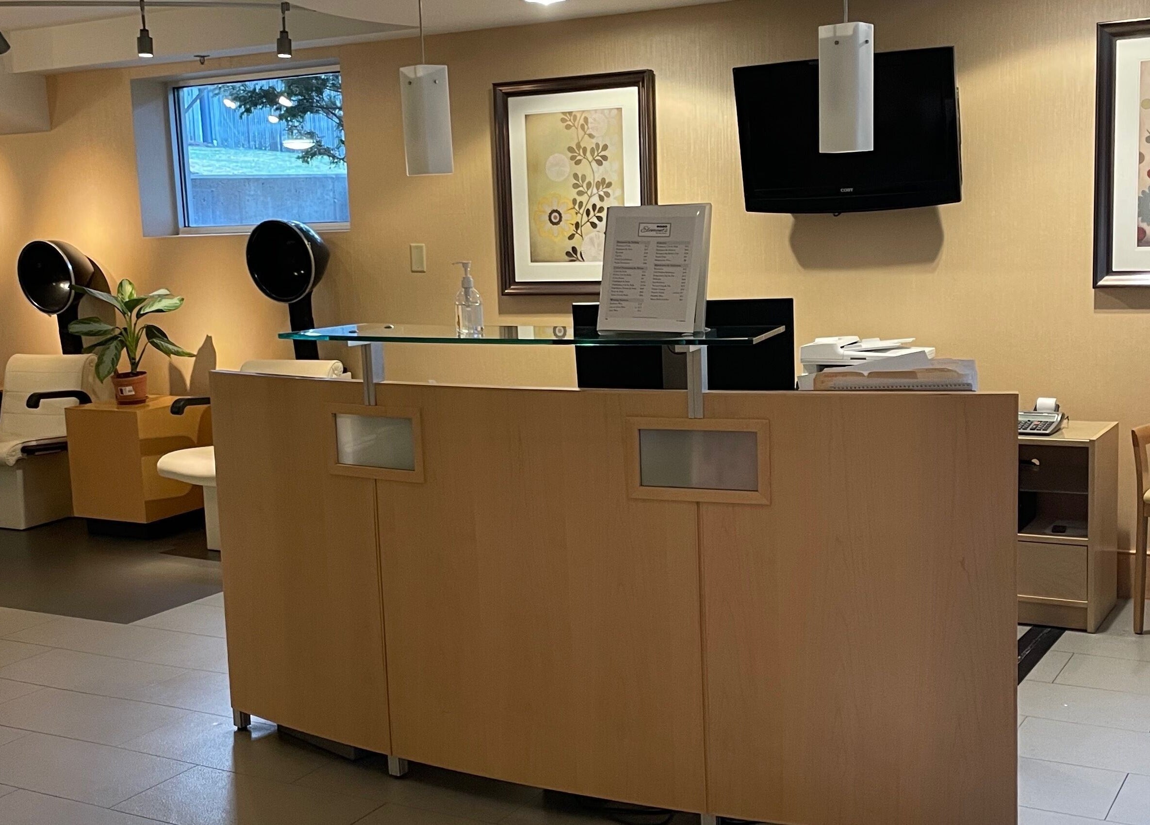 Reception area at North Hill Elements Day Spa and Salon in Needham, Massachusetts, US with modern decor.