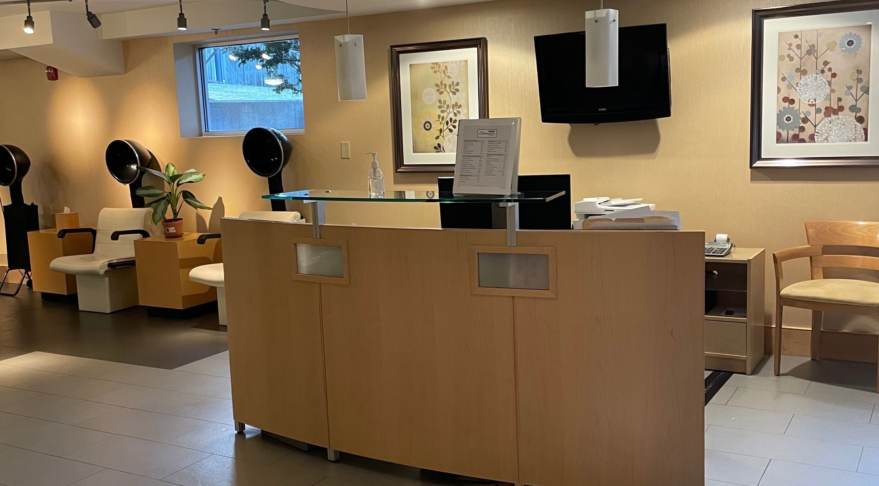 Reception area at North Hill Elements Day Spa and Salon in Needham, Massachusetts, US with modern decor.