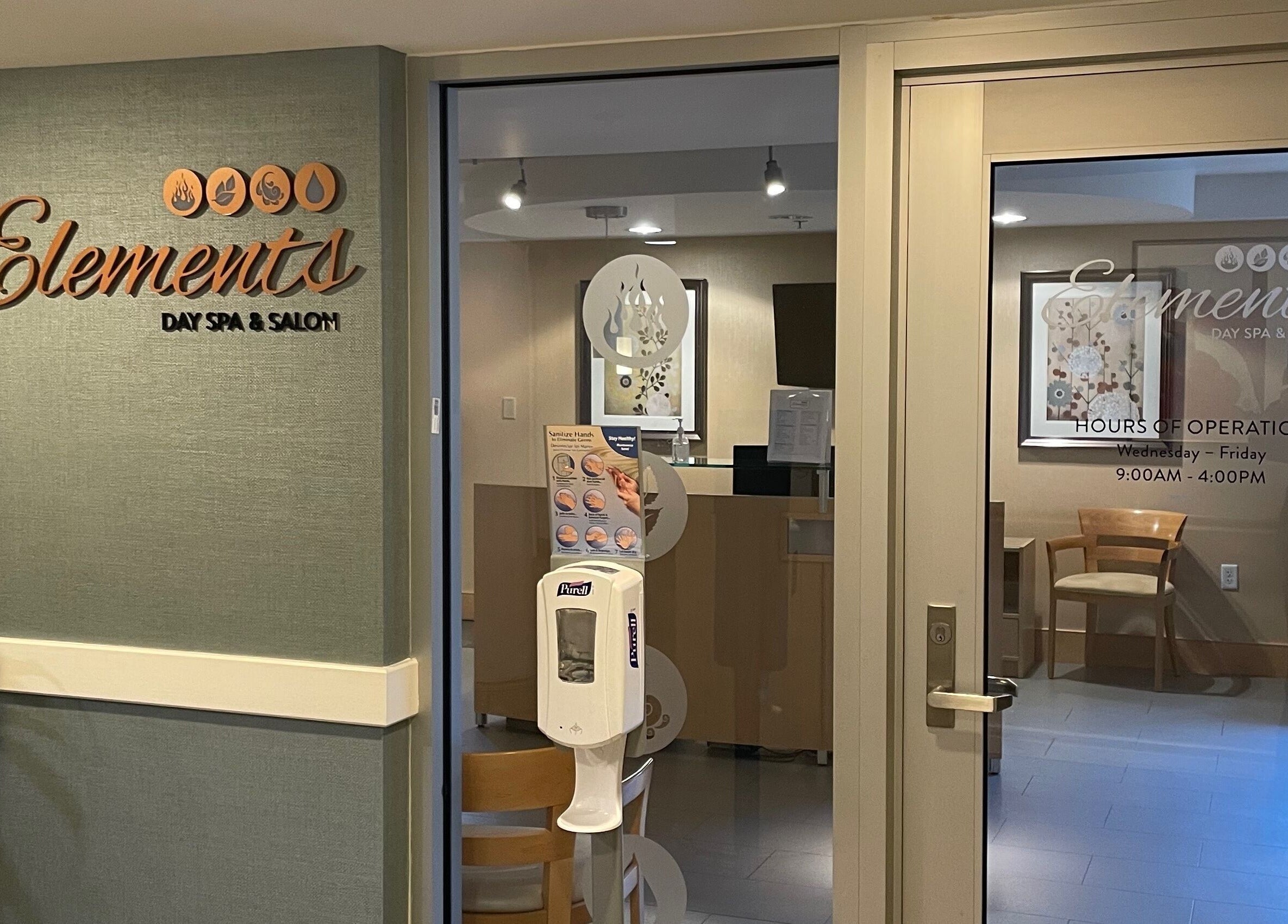 Entrance to North Hill Elements Day Spa and Salon in Needham, Massachusetts, showcasing elegant signage.