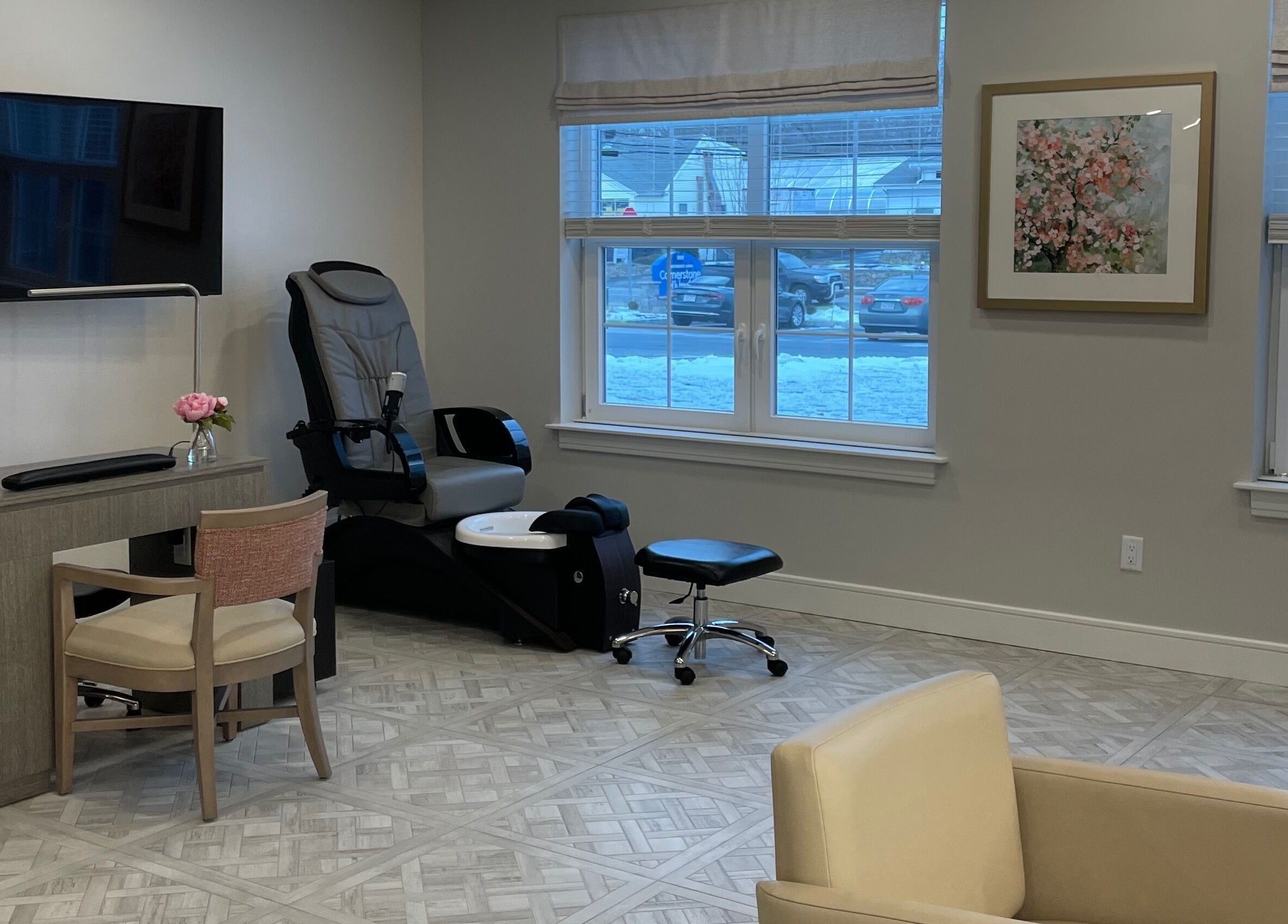 Cozy seating area and nail station at Cornerstone of Weymouth Salon, Weymouth, Massachusetts, US.