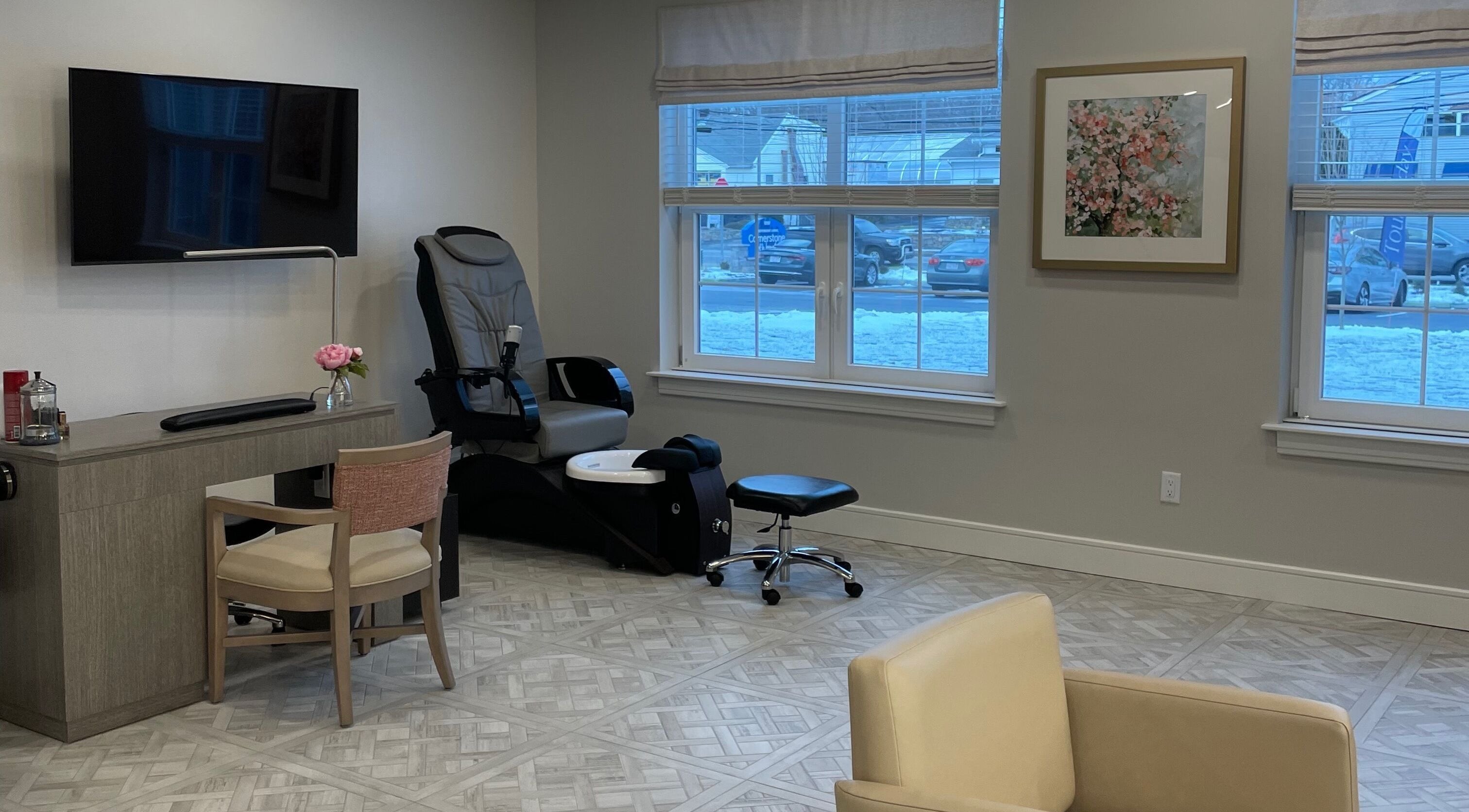 Cozy seating area and nail station at Cornerstone of Weymouth Salon, Weymouth, Massachusetts, US.