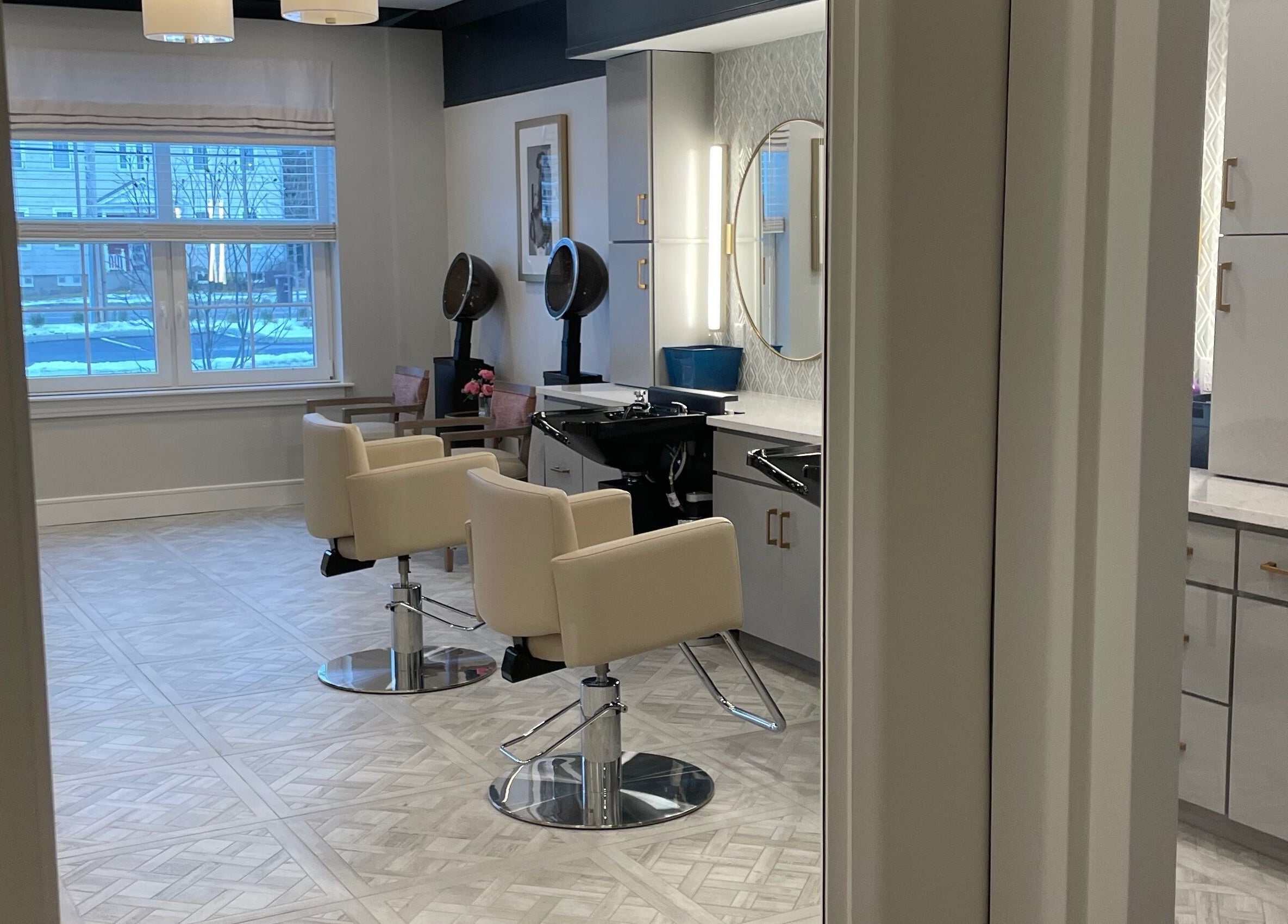 Modern salon interior at Cornerstone of Weymouth Salon, Weymouth, Massachusetts, US, featuring chic furnishings.