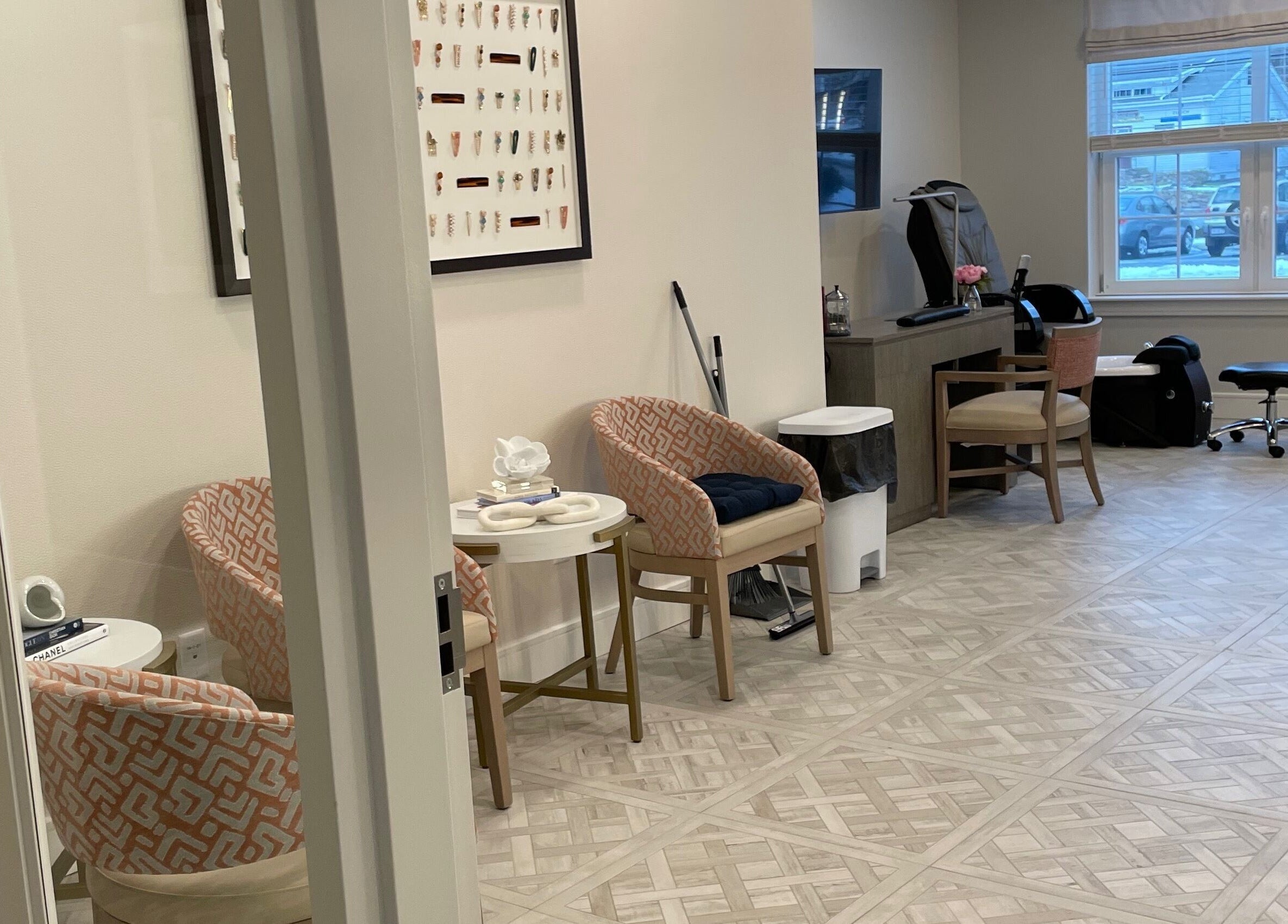 Cozy interior of Cornerstone of Weymouth Salon, Weymouth, Massachusetts. Modern chairs and styling area.
