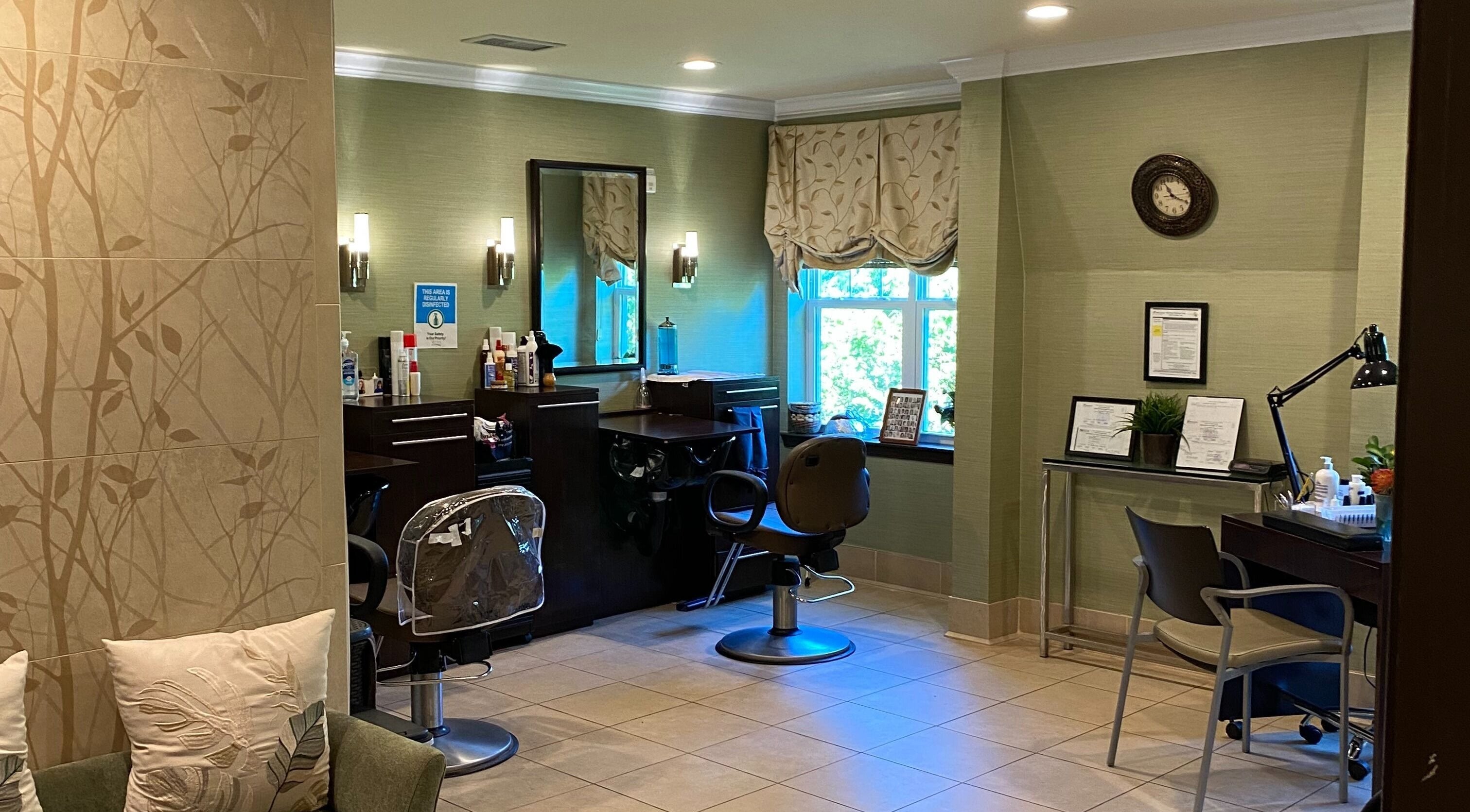 Cozy salon setup at Brightview Fallsgrove Salon in Rockville, Maryland, US with chairs, mirrors, and decor.