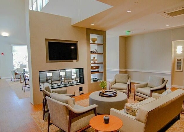 Relaxing lounge at Cordwainer Bliss Salon, Norwell, Massachusetts, US, featuring cozy seating and modern decor.