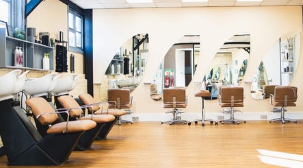 Modern salon chairs and mirrors at House of Hair by Amy Grace, Reading, England, GB.