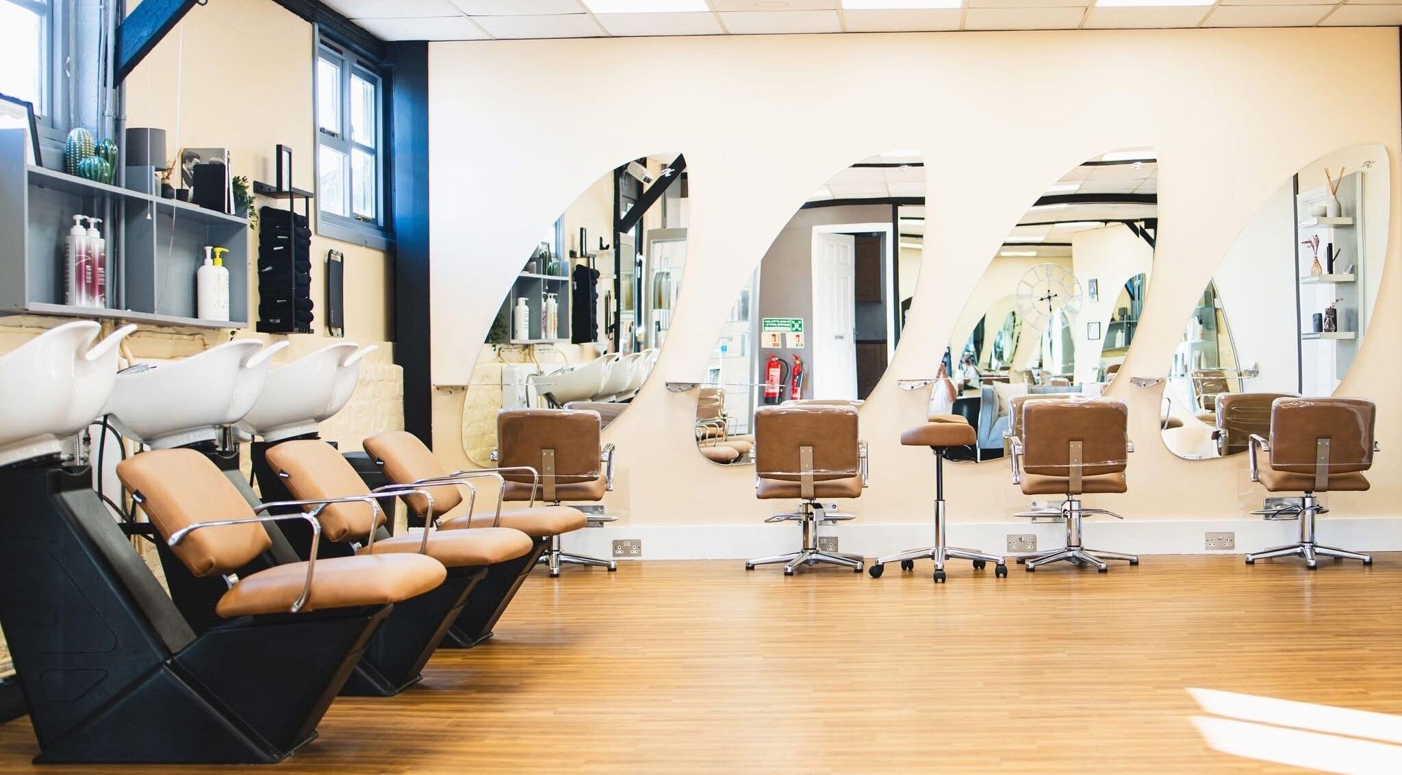 Modern salon chairs and mirrors at House of Hair by Amy Grace, Reading, England, GB.